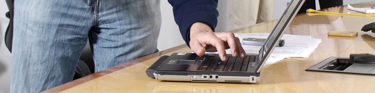 Individual typing on computer